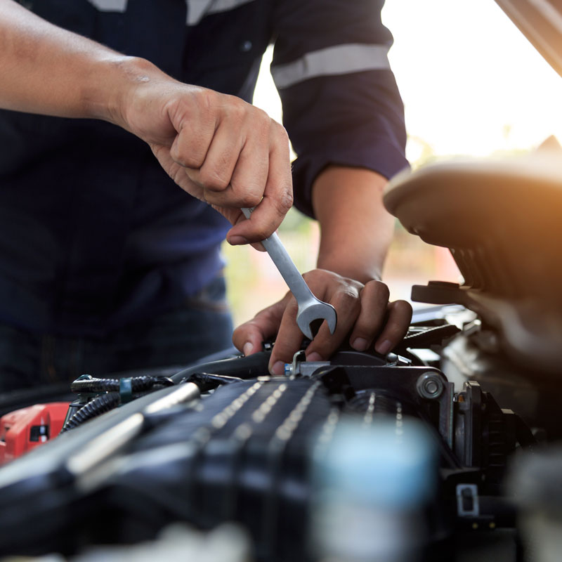 auto mechanic working on engine